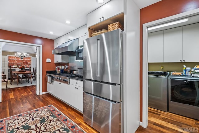 kitchen featuring white cabinets, stainless steel appliances, separate washer and dryer, and dark hardwood / wood-style floors