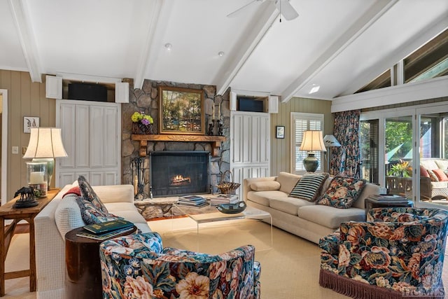 living room featuring a fireplace, vaulted ceiling with beams, and ceiling fan