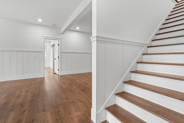 1310 New Settlers Way, Glenville, NC 28736 - staircase featuring wood finished floors, a wainscoted wall, and recessed lighting