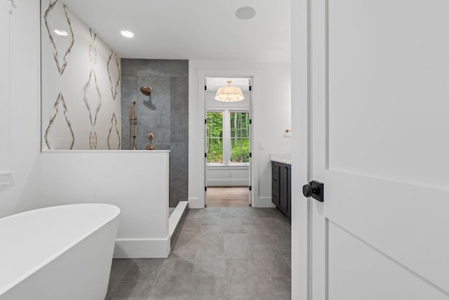 1310 New Settlers Way, Glenville, NC 28736 - bathroom featuring walk in shower, a soaking tub, vanity, tile patterned floors, and recessed lighting