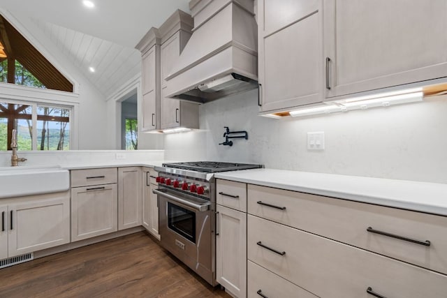 1310 New Settlers Way, Glenville, NC 28736 - kitchen with luxury stove, custom exhaust hood, vaulted ceiling, light countertops, and dark wood-style floors
