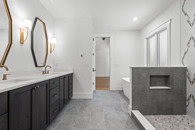 1310 New Settlers Way, Glenville, NC 28736 - full bath featuring double vanity, a freestanding tub, tile patterned floors, recessed lighting, and a shower