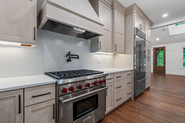 1310 New Settlers Way, Glenville, NC 28736 - kitchen featuring high end appliances, premium range hood, light countertops, tasteful backsplash, and dark wood finished floors