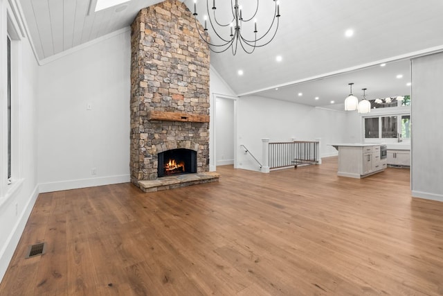 1310 New Settlers Way, Glenville, NC 28736 - unfurnished living room with lofted ceiling, recessed lighting, light wood-type flooring, ornamental molding, and a chandelier