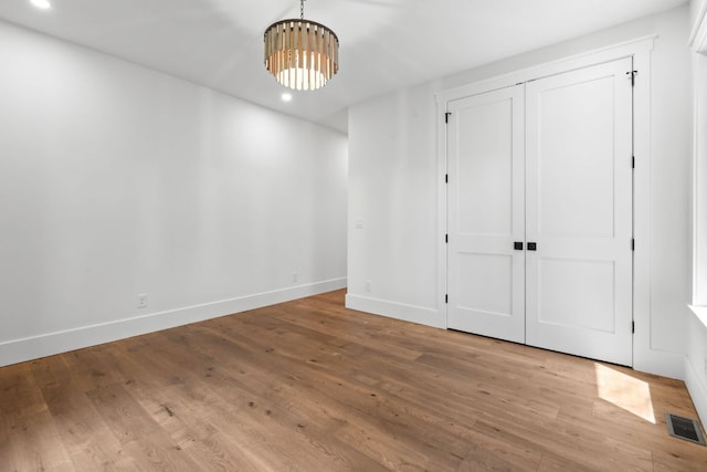 1310 New Settlers Way, Glenville, NC 28736 - unfurnished dining area featuring wood finished floors, a chandelier, and recessed lighting