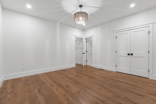 1310 New Settlers Way, Glenville, NC 28736 - unfurnished bedroom featuring wood finished floors, a chandelier, and recessed lighting