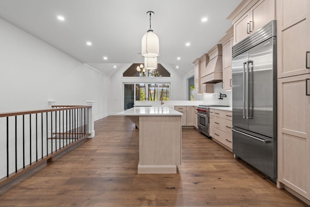 1310 New Settlers Way, Glenville, NC 28736 - kitchen featuring high quality appliances, vaulted ceiling, light countertops, a kitchen bar, and a kitchen island