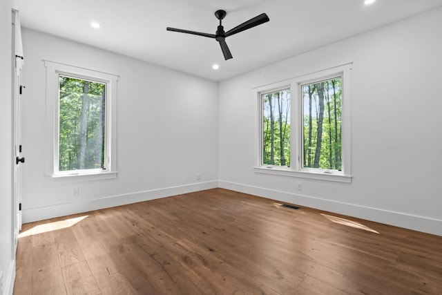 1310 New Settlers Way, Glenville, NC 28736 - empty room with healthy amount of natural light, ceiling fan, hardwood / wood-style flooring, and recessed lighting