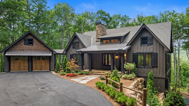 1310 New Settlers Way, Glenville, NC 28736 - view of front of home with a standing seam roof, covered porch, roof with shingles, a metal roof, and a chimney