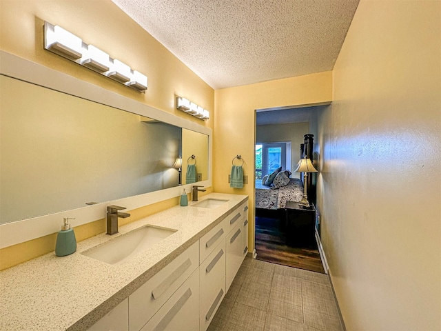 34 Sun Valley Cir Unit 8001, Sky Valley, GA 30537 - bathroom featuring double vanity, a textured ceiling, and connected bathroom