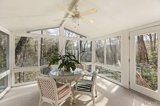 sunroom / solarium with vaulted ceiling with beams and ceiling fan