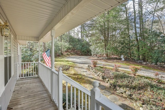 wooden terrace featuring covered porch