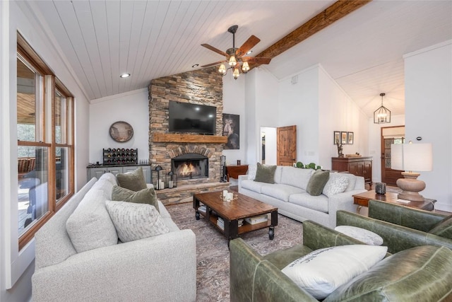 living area featuring beam ceiling, a fireplace, high vaulted ceiling, wooden ceiling, and ceiling fan with notable chandelier