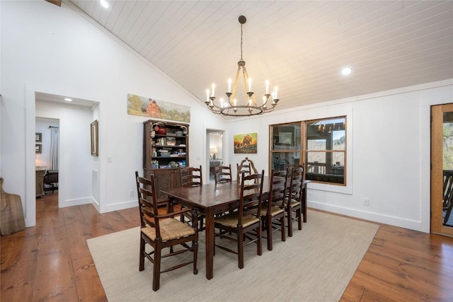 dining room featuring baseboards, wooden ceiling, hardwood / wood-style flooring, and an inviting chandelier