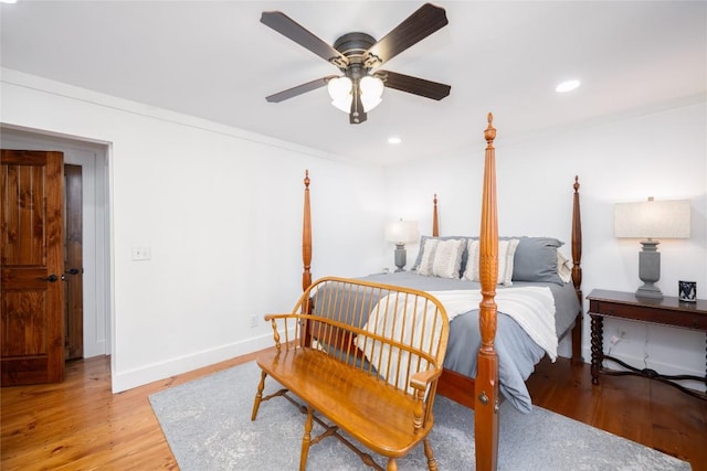 bedroom featuring light wood finished floors, recessed lighting, a ceiling fan, and baseboards