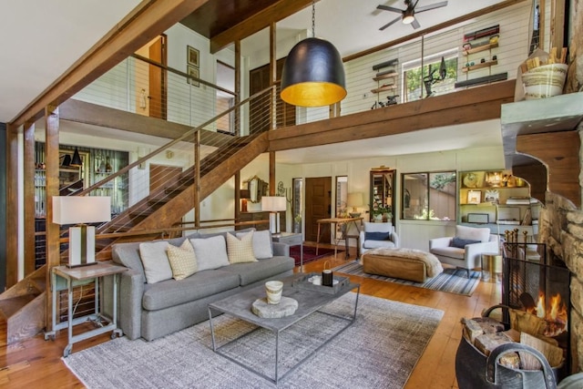 15 Elm Ct, Highlands, NC 28741 - living area with wood finished floors, a high ceiling, ceiling fan, and stairway