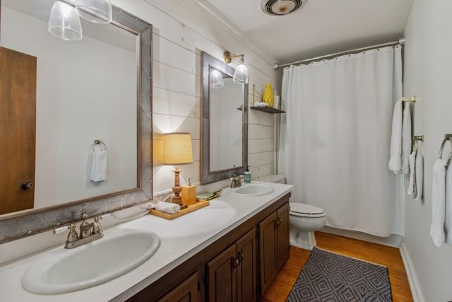 15 Elm Ct, Highlands, NC 28741 - full bathroom featuring double vanity, wood finished floors, and a shower with shower curtain