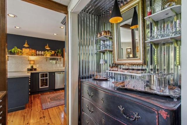 15 Elm Ct, Highlands, NC 28741 - indoor dry bar featuring stainless steel dishwasher, wood finished floors, wine cooler, recessed lighting, and backsplash