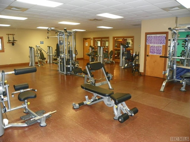 exercise room featuring a paneled ceiling