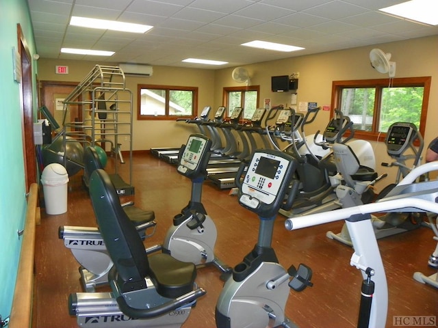 workout area with an AC wall unit