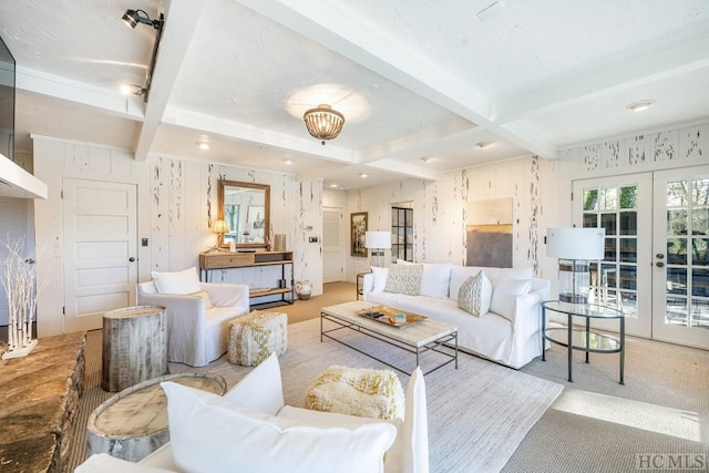 living room featuring light colored carpet, beam ceiling, and french doors