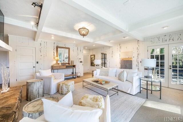 living room with beam ceiling, light carpet, french doors, and coffered ceiling