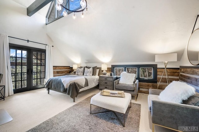 bedroom with french doors, beam ceiling, high vaulted ceiling, and carpet