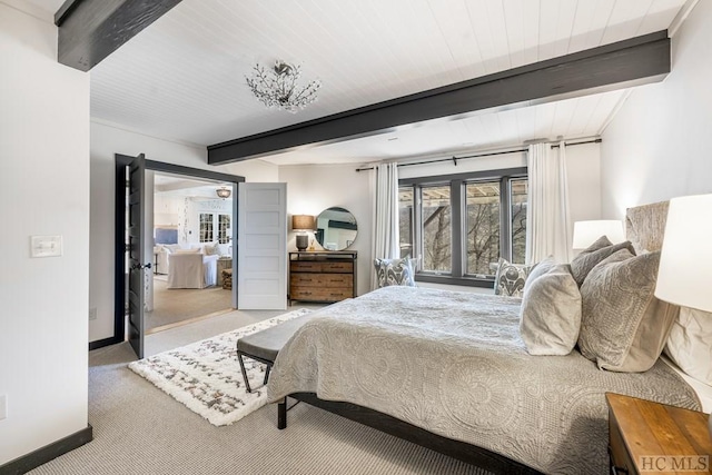 bedroom featuring light carpet and beamed ceiling