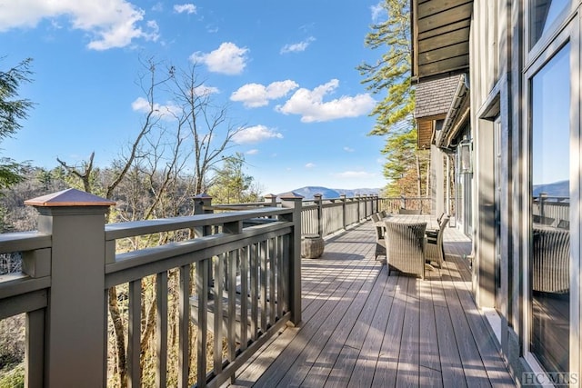 wooden terrace featuring a mountain view