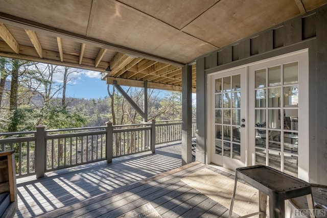 wooden deck featuring french doors