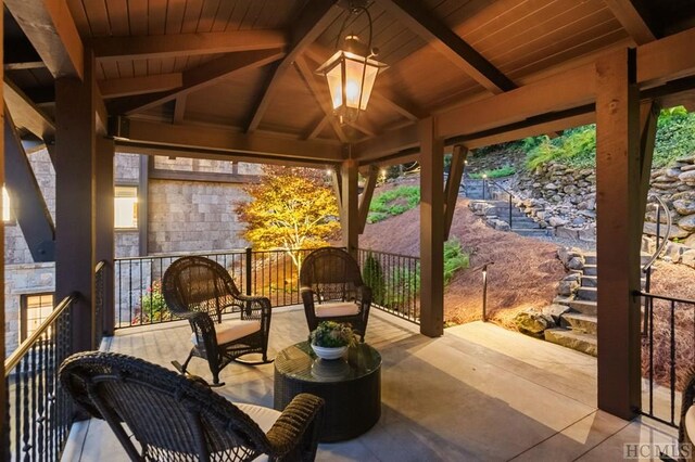 view of patio / terrace with an outdoor living space, a gazebo, and ceiling fan