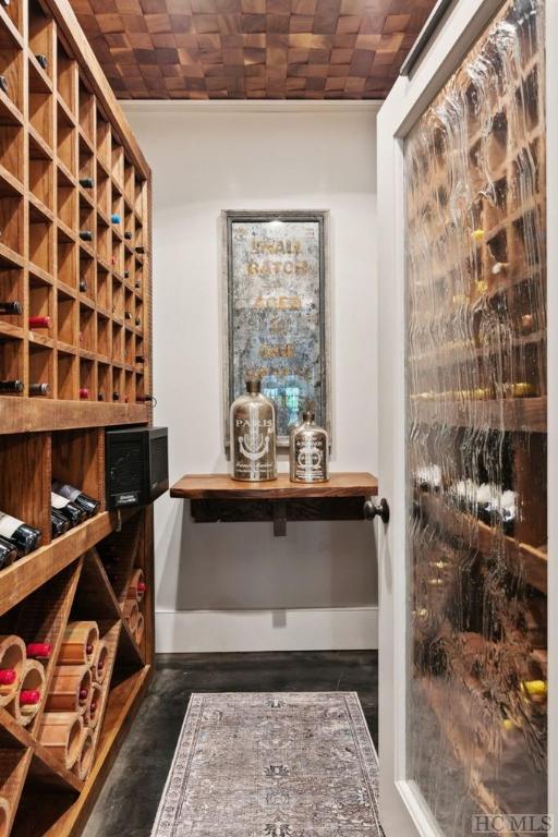 wine cellar with lofted ceiling and brick ceiling