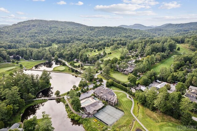 birds eye view of property with a water and mountain view