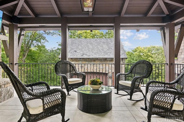 sunroom with beam ceiling