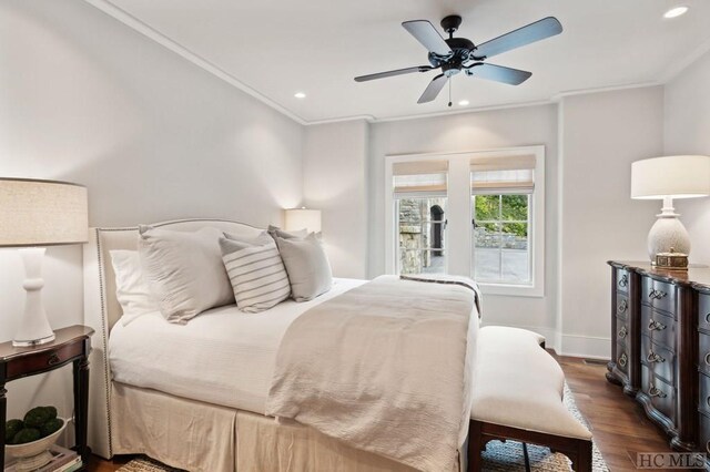 bedroom featuring ornamental molding, dark hardwood / wood-style floors, and ceiling fan