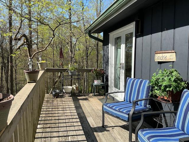 wooden terrace featuring french doors