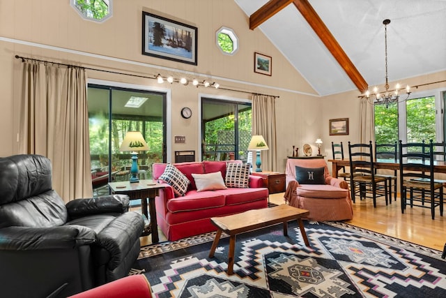 145 Mount Lori Dr, Highlands, NC 28741 - living room with high vaulted ceiling, a chandelier, beamed ceiling, and wood finished floors