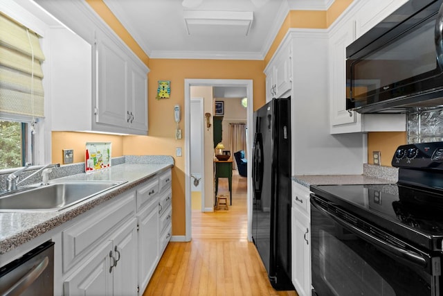 145 Mount Lori Dr, Highlands, NC 28741 - kitchen featuring black appliances, white cabinets, light wood finished floors, light countertops, and crown molding