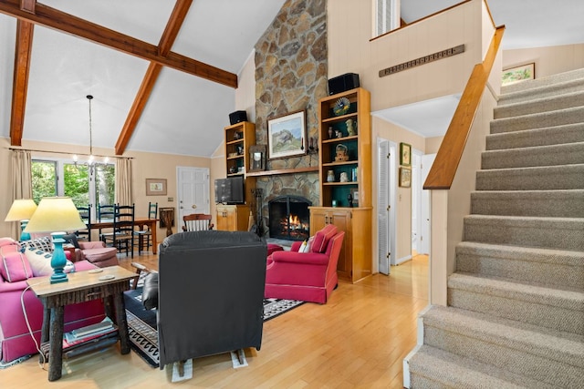 145 Mount Lori Dr, Highlands, NC 28741 - living room with wood finished floors, high vaulted ceiling, stairway, a stone fireplace, and beamed ceiling