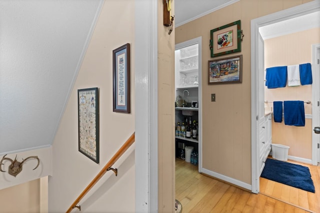 145 Mount Lori Dr, Highlands, NC 28741 - hall featuring light wood-style flooring, crown molding, and an upstairs landing
