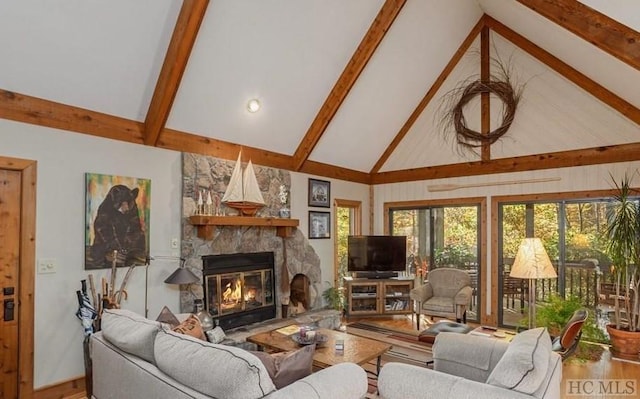 living room with high vaulted ceiling, beam ceiling, hardwood / wood-style floors, and a stone fireplace