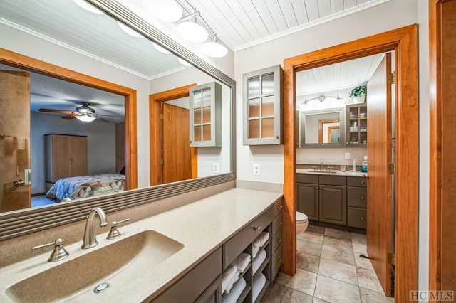 bathroom with crown molding, tile patterned flooring, wooden ceiling, toilet, and vanity