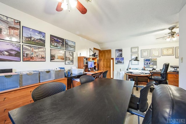 office with lofted ceiling, a textured ceiling, and ceiling fan