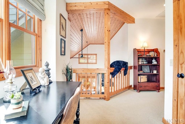 office space featuring lofted ceiling with beams, carpet flooring, and wood ceiling