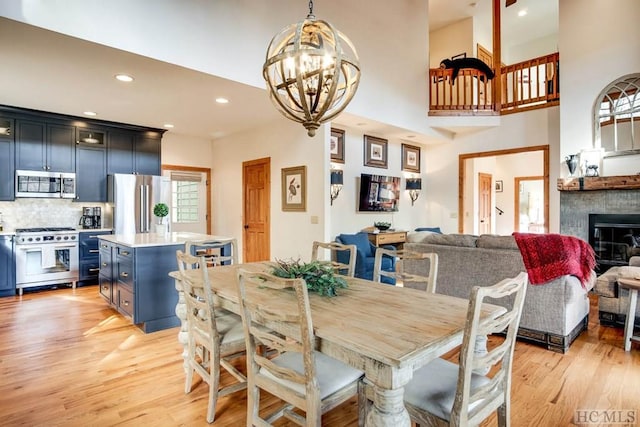 dining room with a chandelier and light hardwood / wood-style flooring