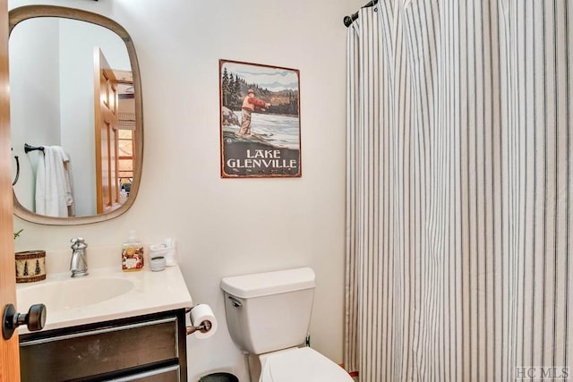 bathroom with vanity and toilet