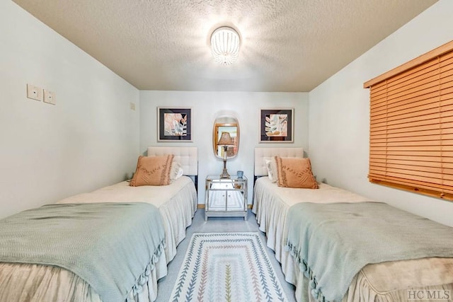 bedroom featuring a textured ceiling