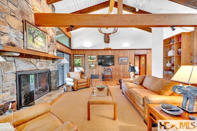 43 Chimney Pt, Lake Toxaway, NC 28747 - living area featuring a stone fireplace, wood finished floors, wood walls, beamed ceiling, and high vaulted ceiling