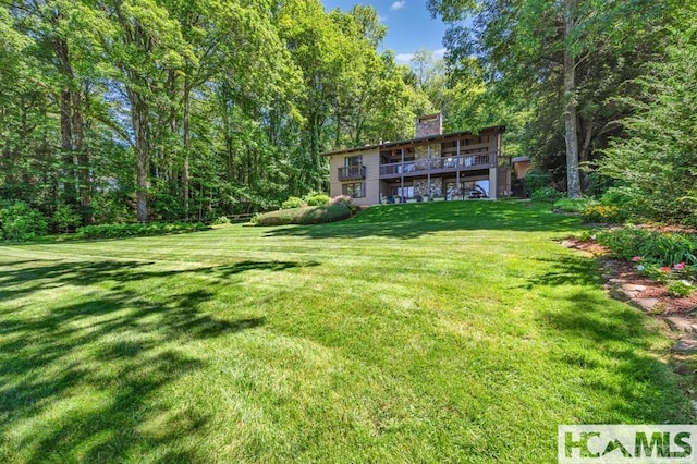 43 Chimney Pt, Lake Toxaway, NC 28747 - view of green lawn with a forest view and a deck