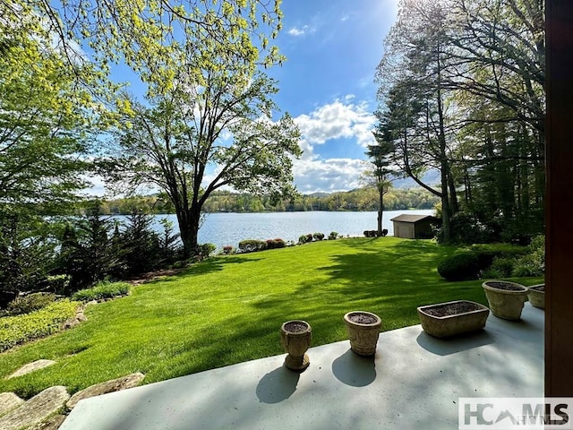 43 Chimney Pt, Lake Toxaway, NC 28747 - view of grassy yard featuring a water view and a patio area